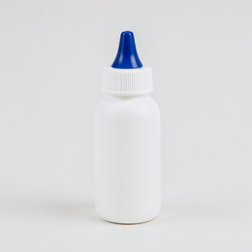 A white squeeze bottle with a blue nasal tip on a clean light background, conveying a simple medical-hygiene feel